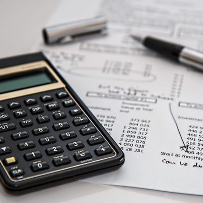 black-calculator-near-ballpoint-pen-on-white-printed-paper-53621-1024x603